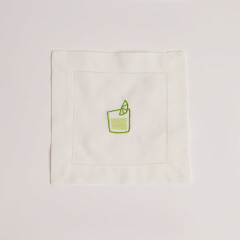 Single white cocktail napkin embroidered with a green mojito glass and lime wedge. Single white cocktail napkin embroidered with a green mojito glass and lime wedge.