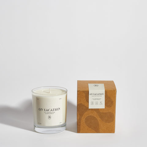 Boujie On Vacation scented jar candle front view with packaging, highlighting luxury gift-ready presentation in a clear glass jar. Boujie On Vacation scented jar candle front view with packaging, highlighting luxury gift-ready presentation in a clear glass jar.