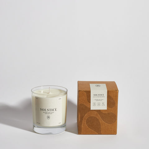 Boujie Solstice jar candle with packaging, handmade with natural soy wax – front view. Boujie Solstice jar candle with packaging, handmade with natural soy wax – front view.