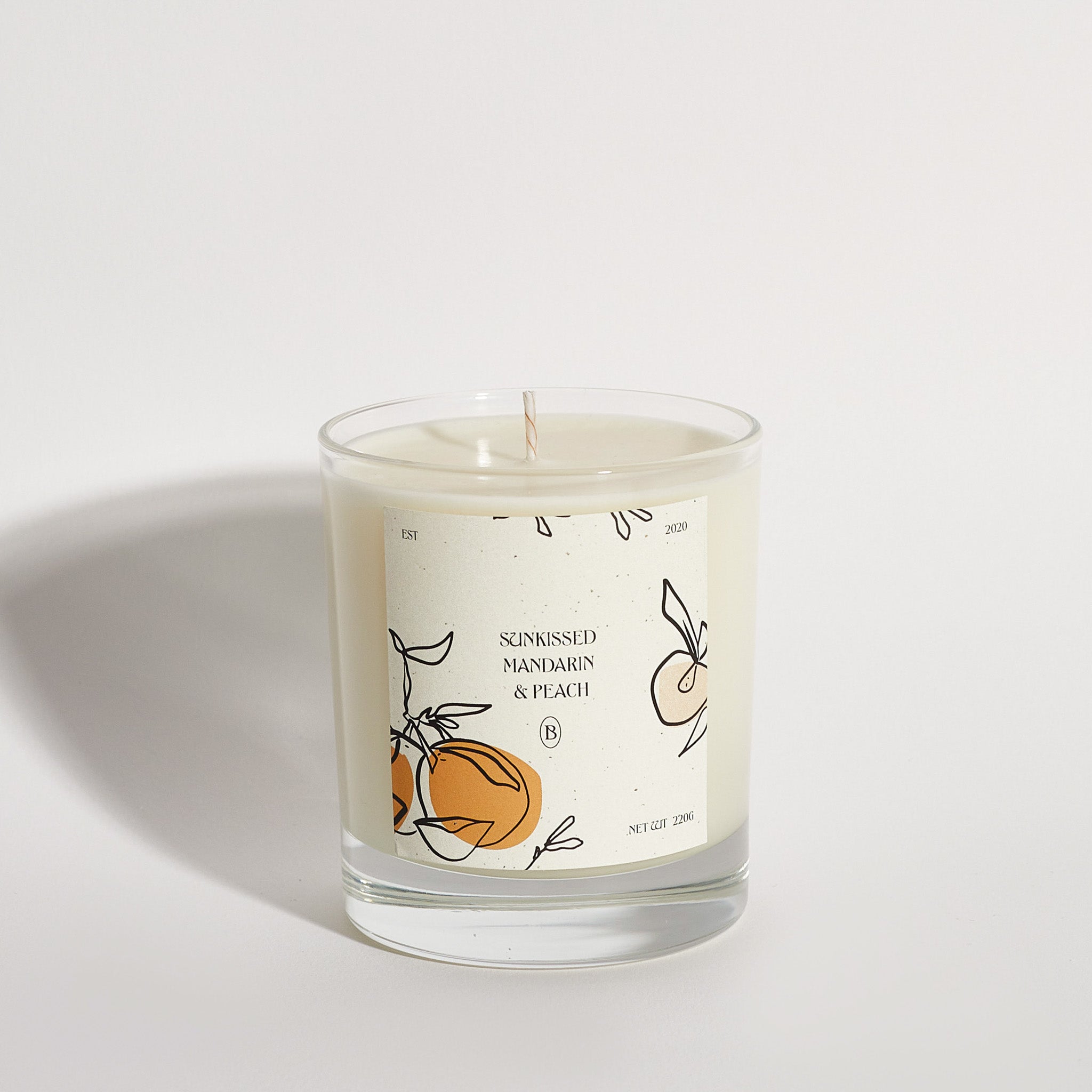 Boujie Sun-kissed Peach and Mandarin jar candle, handmade with natural soy wax – side view. Boujie Sun-kissed Peach and Mandarin jar candle, handmade with natural soy wax – side view.