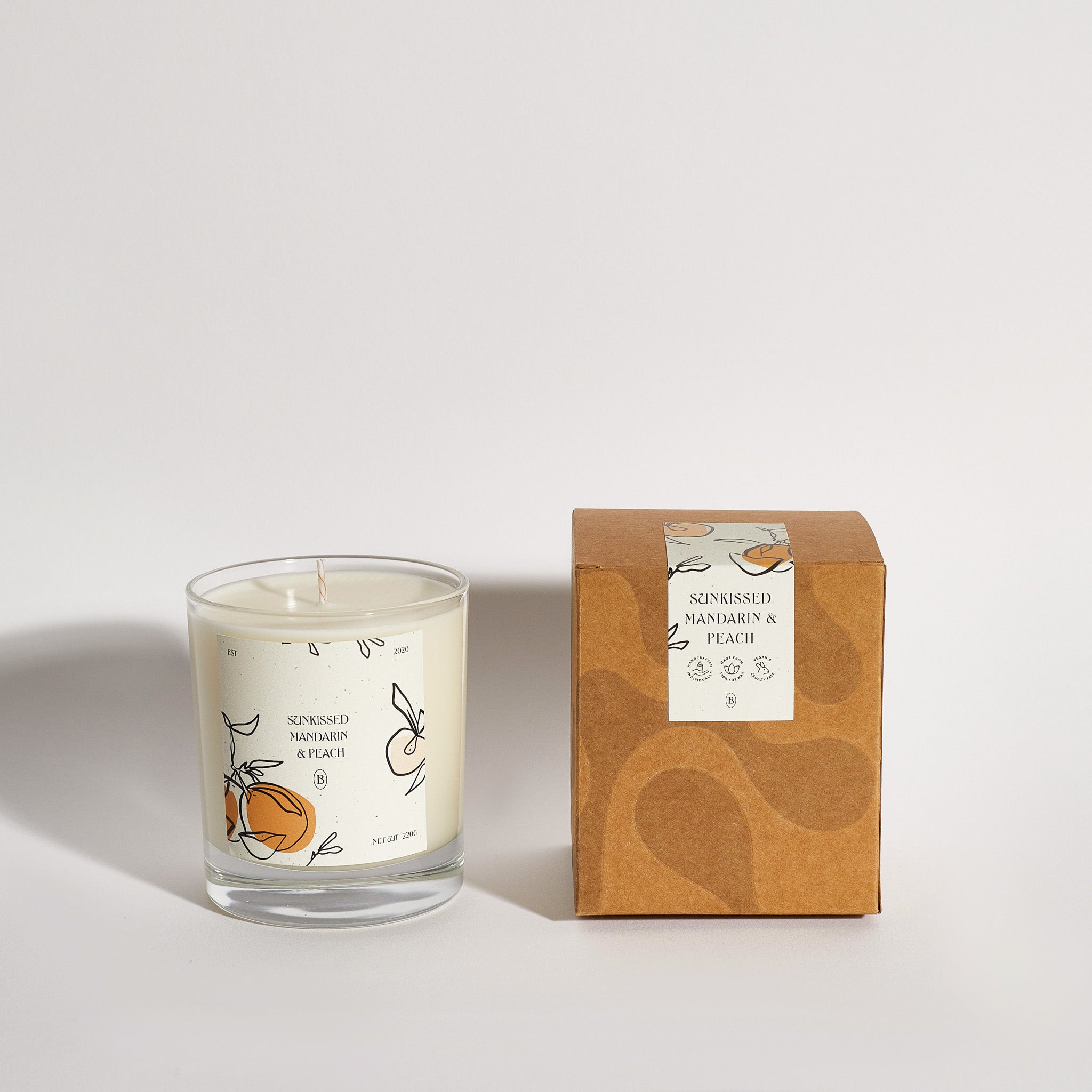 Boujie Sun-kissed Peach and Mandarin jar candle with packaging, handmade with natural soy wax – front view. Boujie Sun-kissed Peach and Mandarin jar candle with packaging, handmade with natural soy wax – front view.