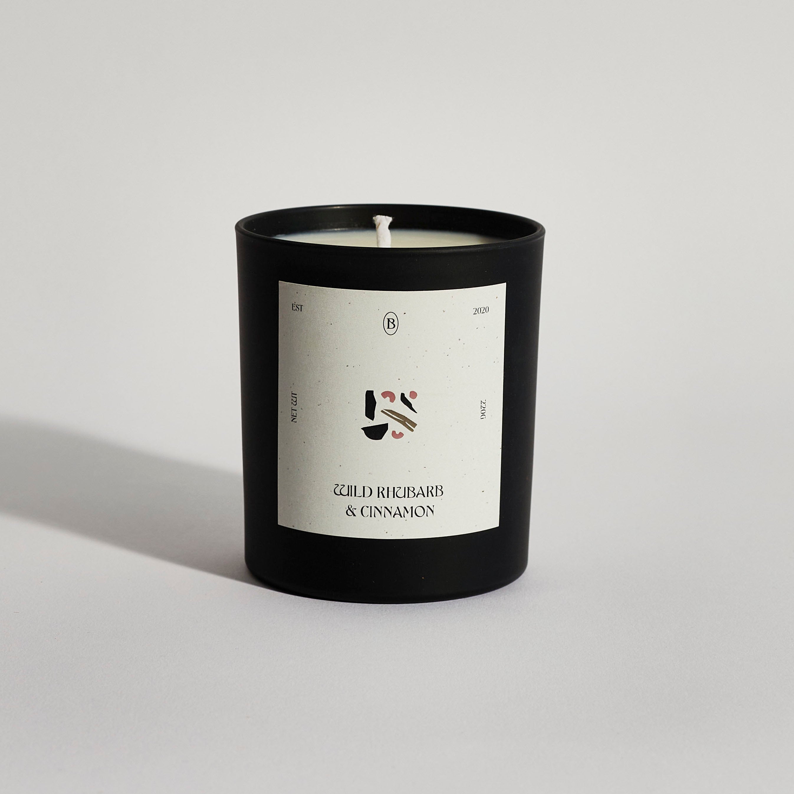 Boujie wild rhubarb and cinnamon black jar candle, handmade with natural soy wax – front view Boujie wild rhubarb and cinnamon black jar candle, handmade with natural soy wax – front view