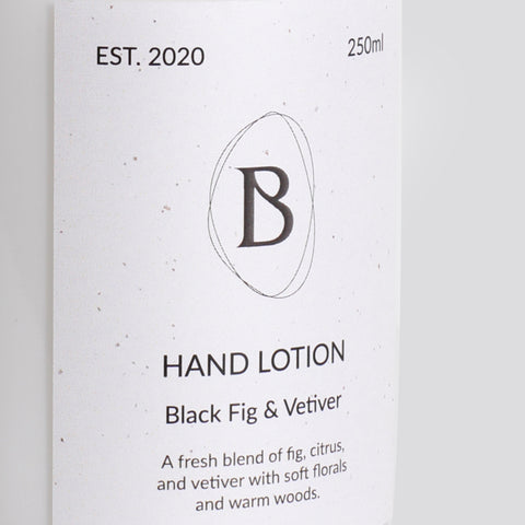Hand lotion packaging with 'B' logo and product description on a white background