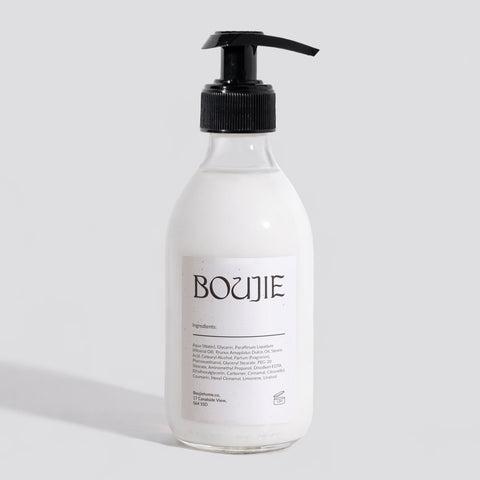 Clear bottle with black pump and 'BOUJIE' label on a light gray background