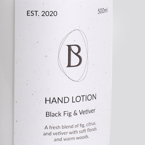 Hand lotion packaging with 'B' logo and product description on a white background