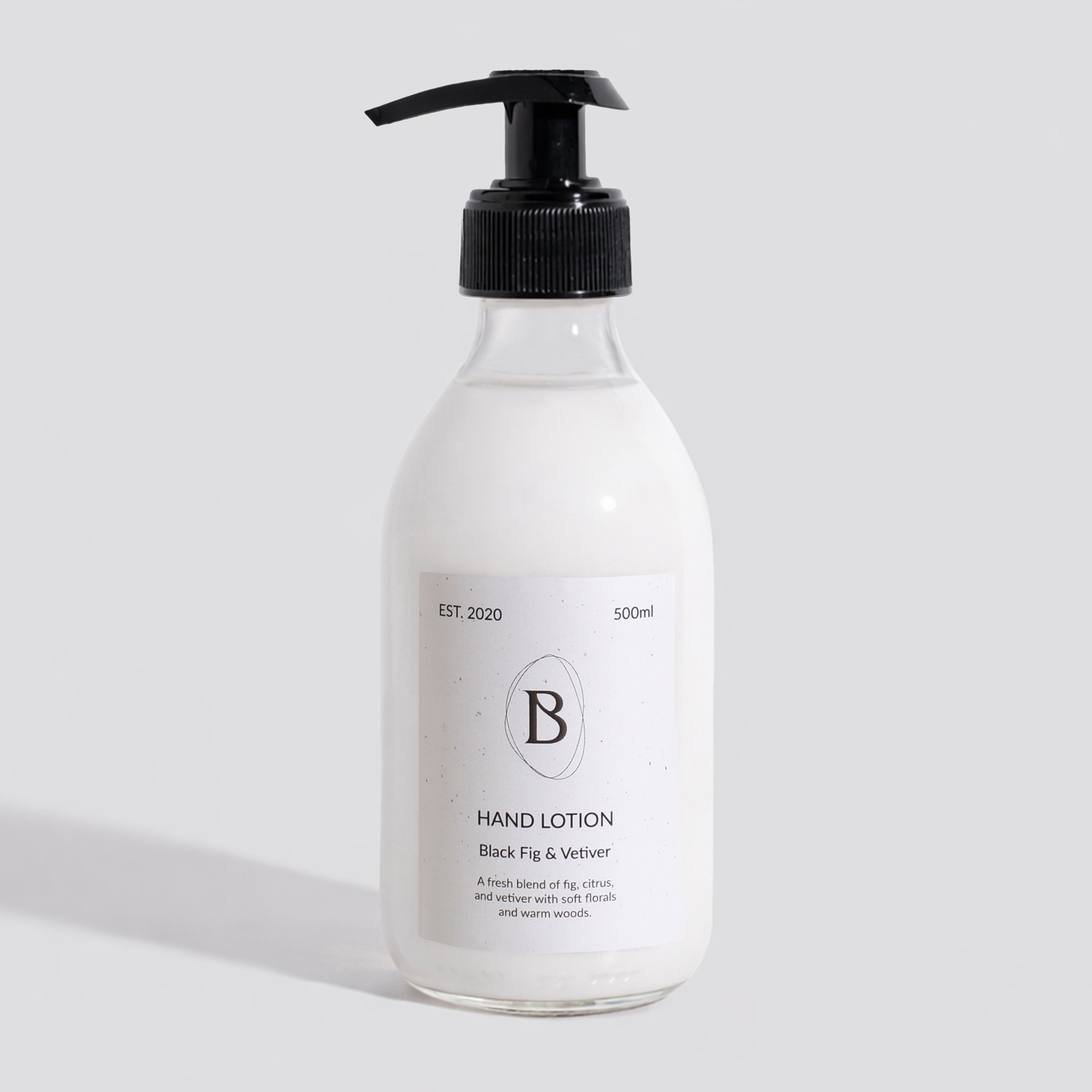 Hand lotion bottle with pump on a light gray background