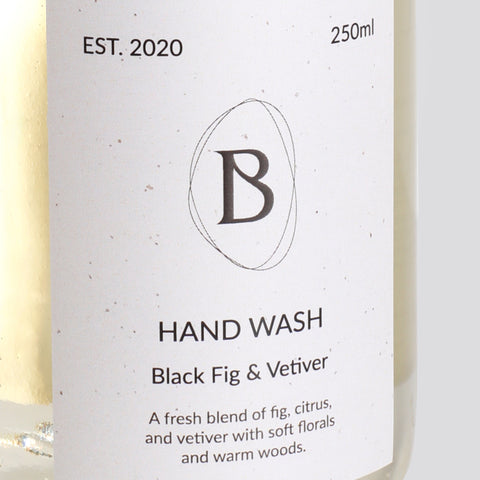 Hand wash bottle label with 'B' logo and product description on a white background