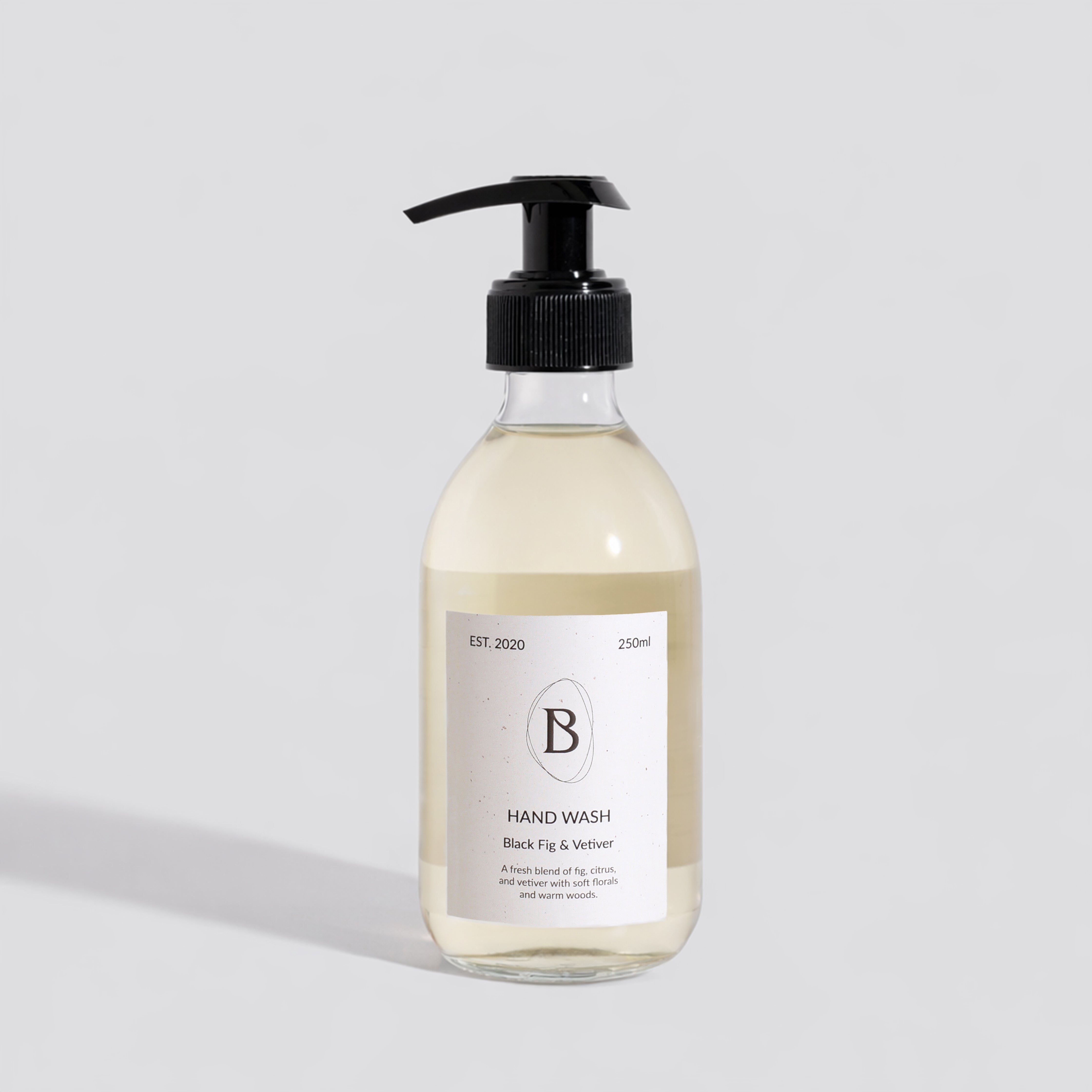 Hand wash bottle with pump on a light gray background