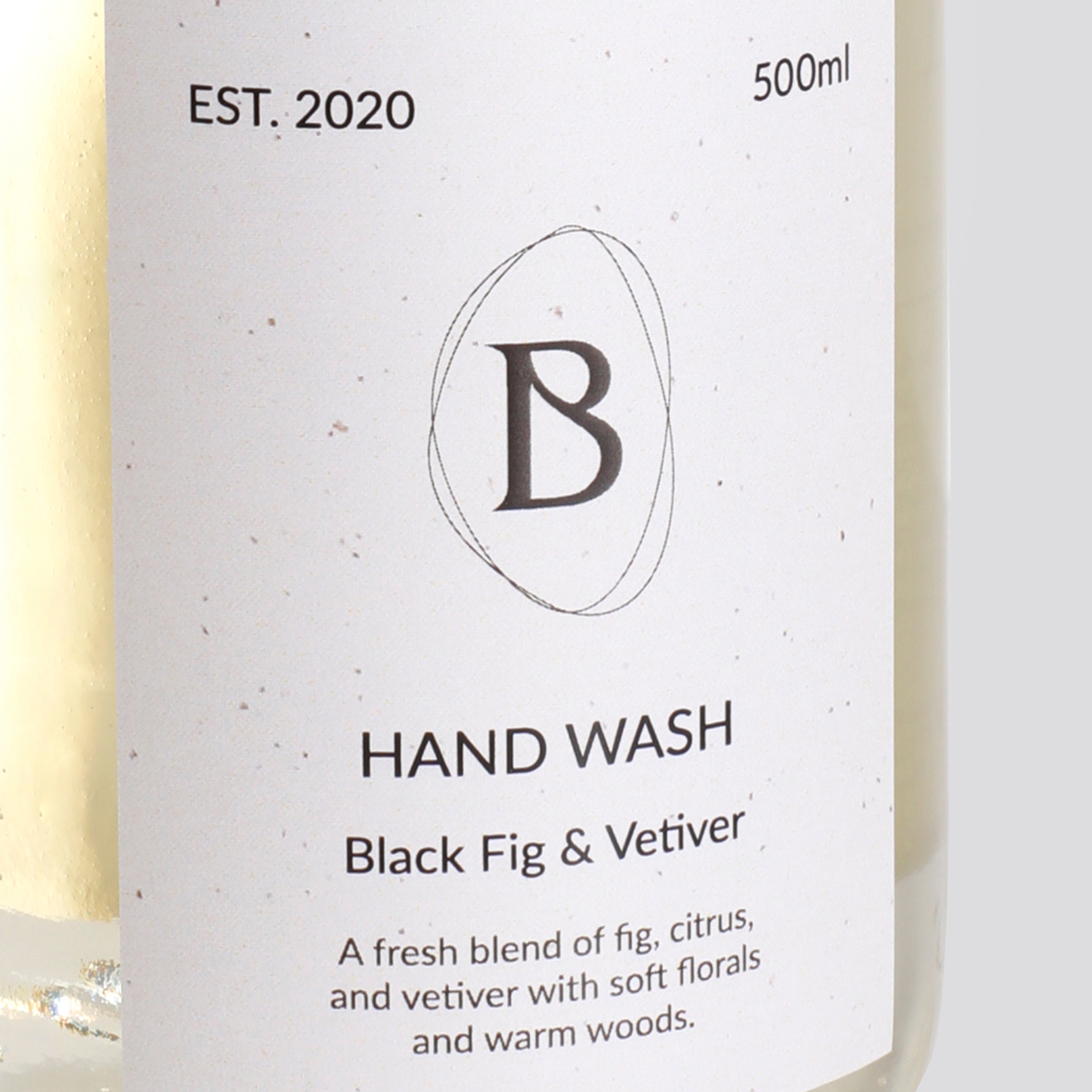 Hand wash bottle label with 'B' logo and product details on a white background