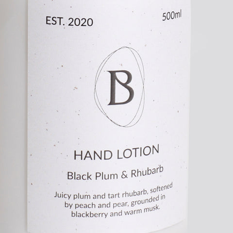 Hand lotion packaging with brand logo and product description on a white background