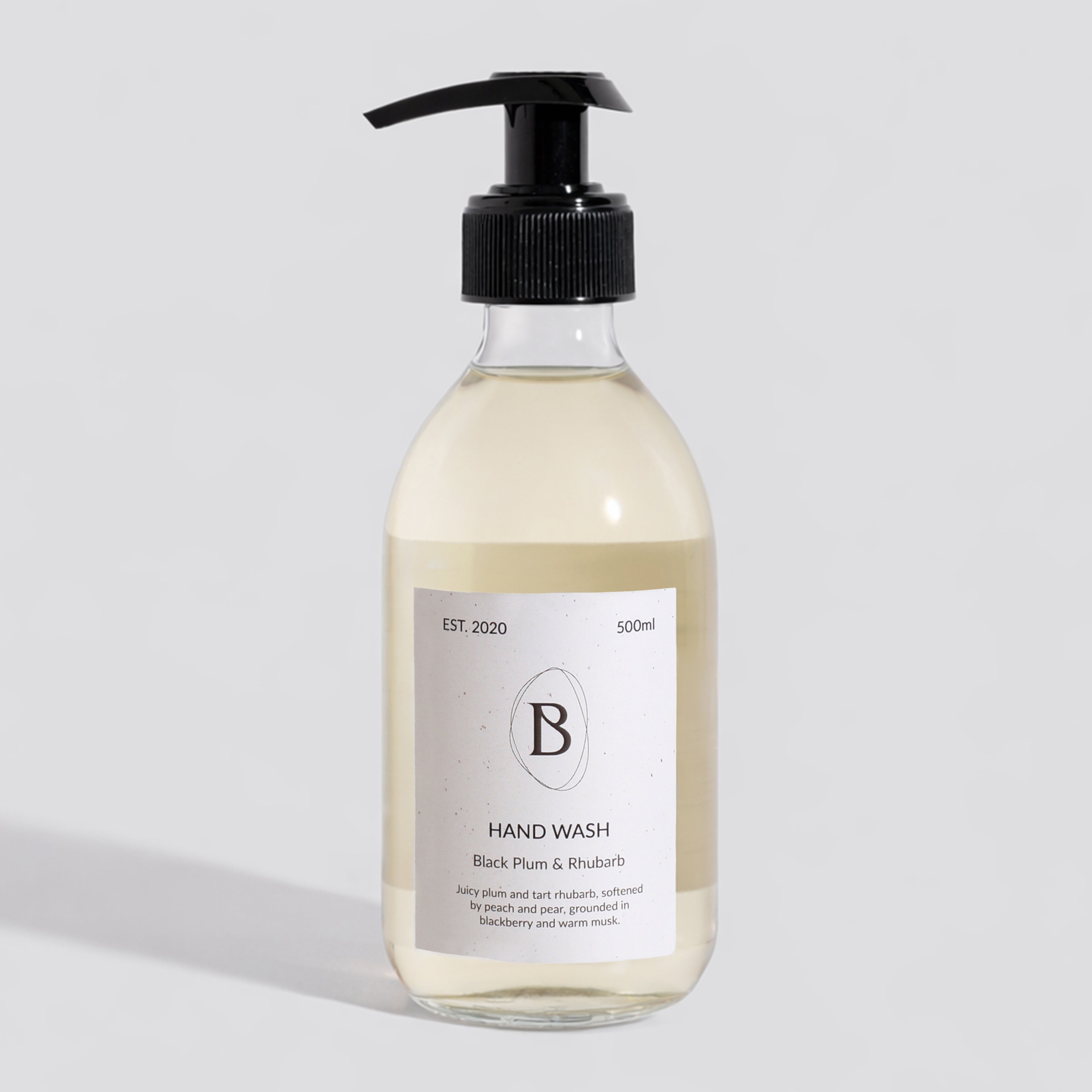 Hand wash bottle with pump on a light gray background