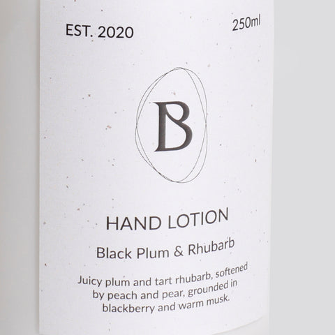 Hand lotion packaging with brand logo and product description on a white background