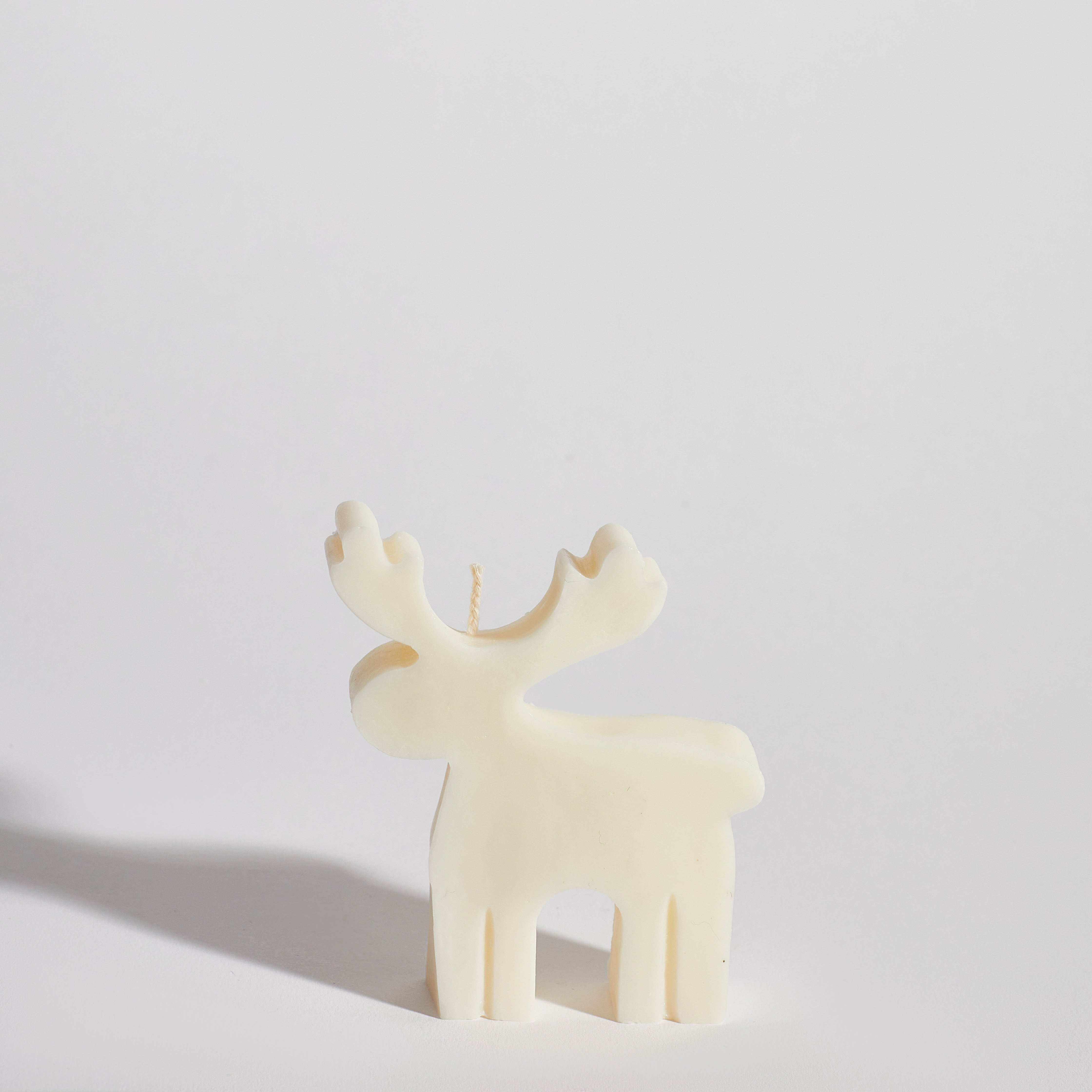 Boujie reindeer decorative candle displayed as elegant Christmas styling piece.