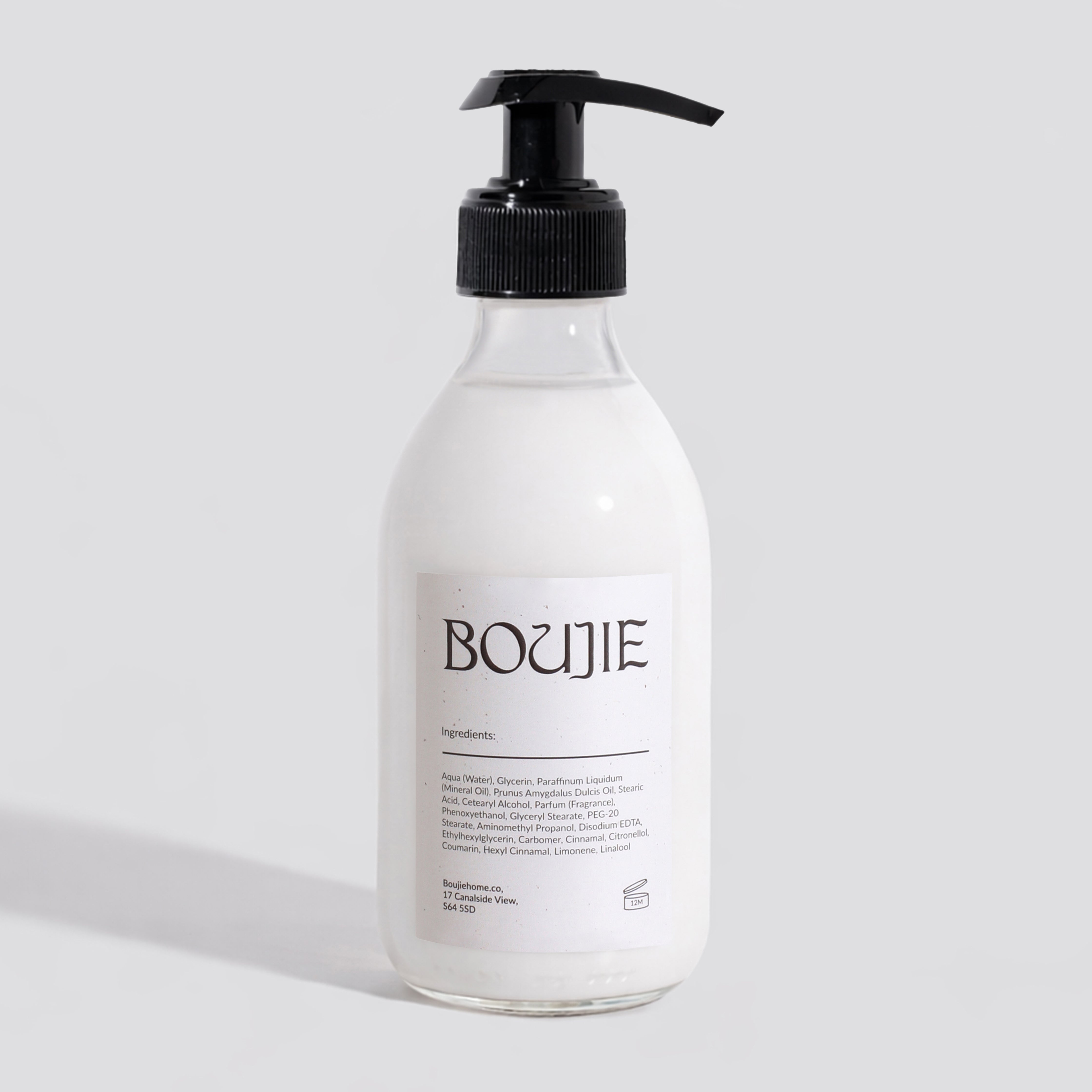 Bottle of Boujie product on a light gray background