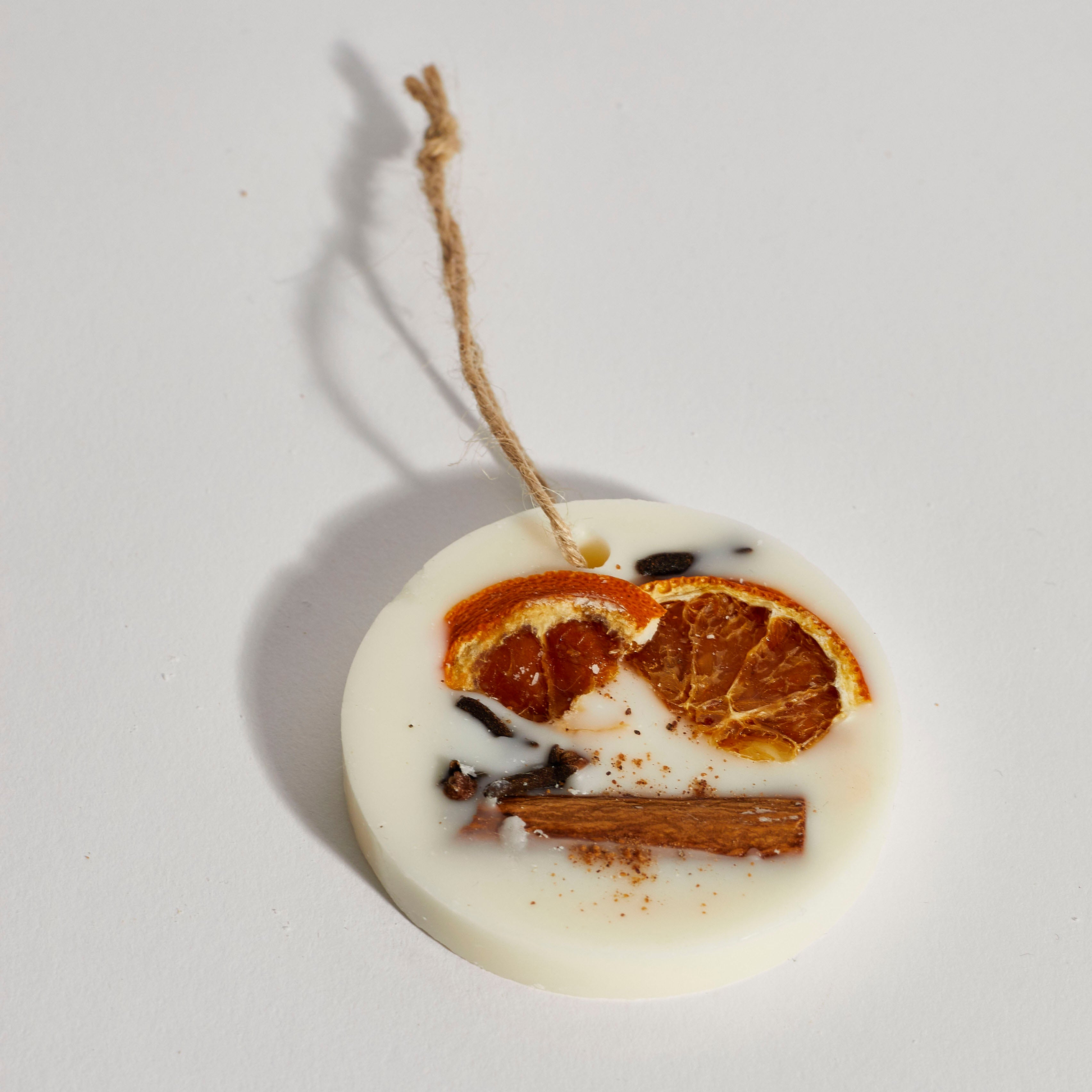 Festive scented circle tree ornament made from natural soy wax.