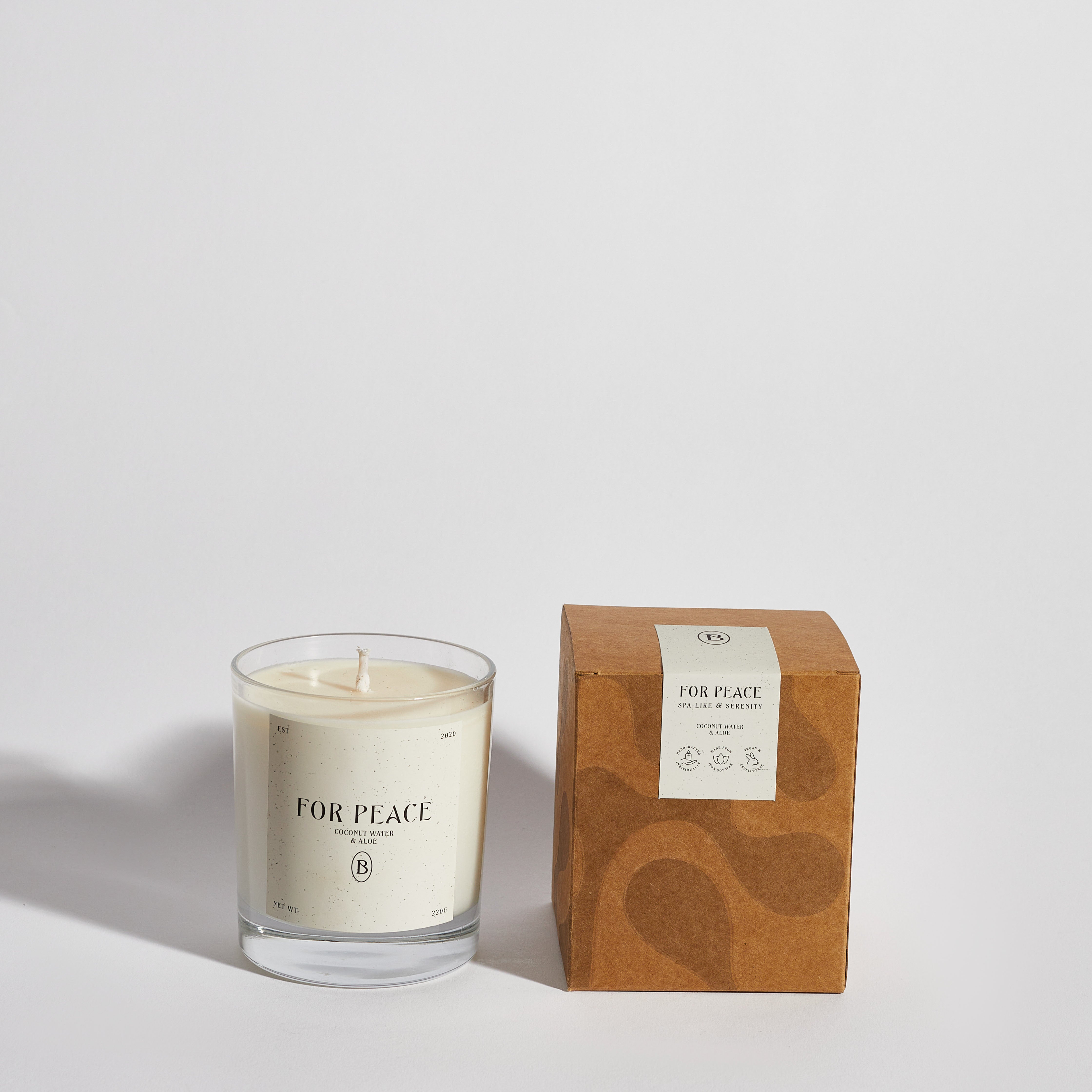 Boujie For Peace jar candle with elegant packaging, infused with citrus, aloe vera, and coconut for a calming, spa-inspired scent – front view.