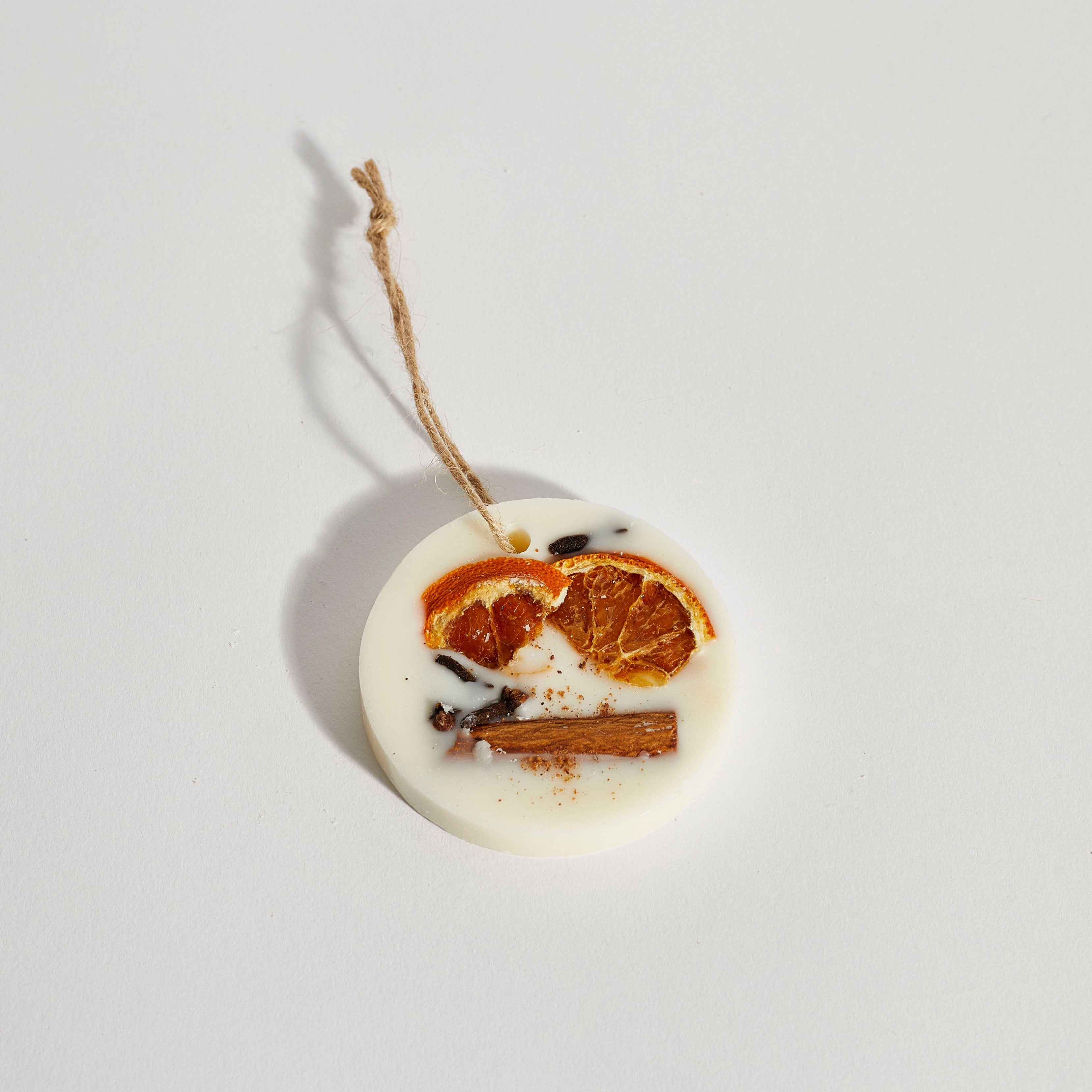 Handmade circle soy wax Christmas decoration with dried orange and cinnamon by Boujie.