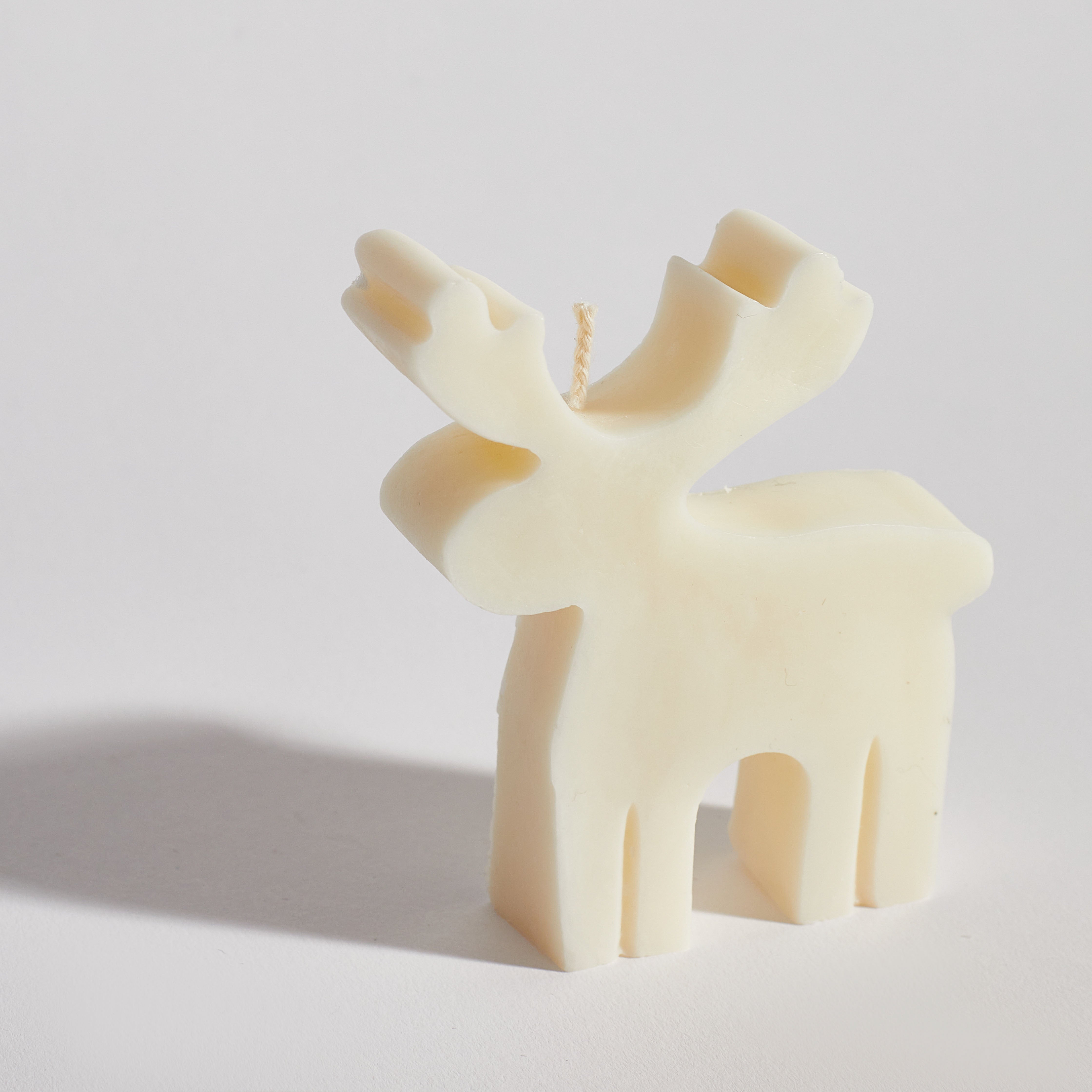 Reindeer decorative candle handmade from 100% natural soy wax in classic cream by Boujie Home Co.