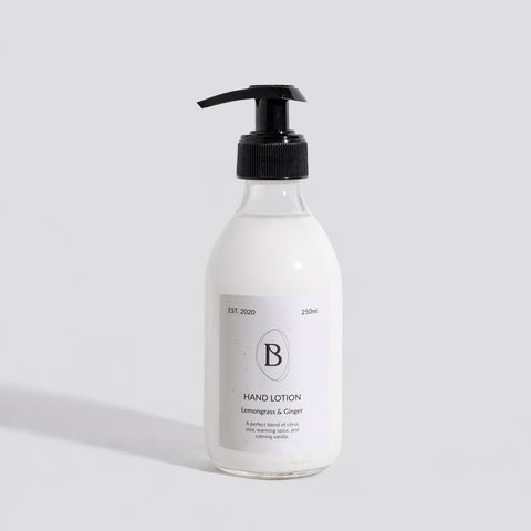 Hand lotion bottle with pump on a light gray background