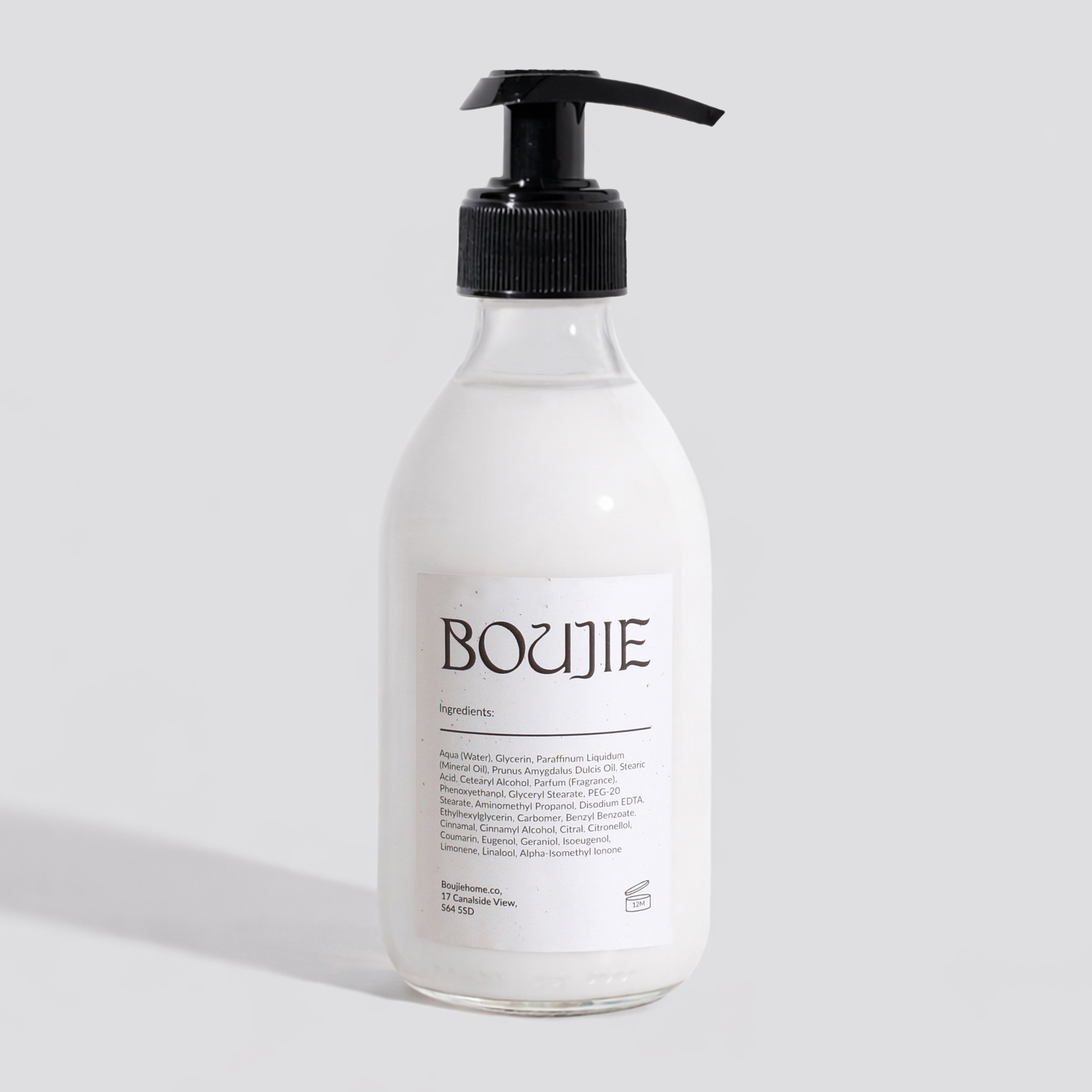 Bottle of Boujie product on a light gray background