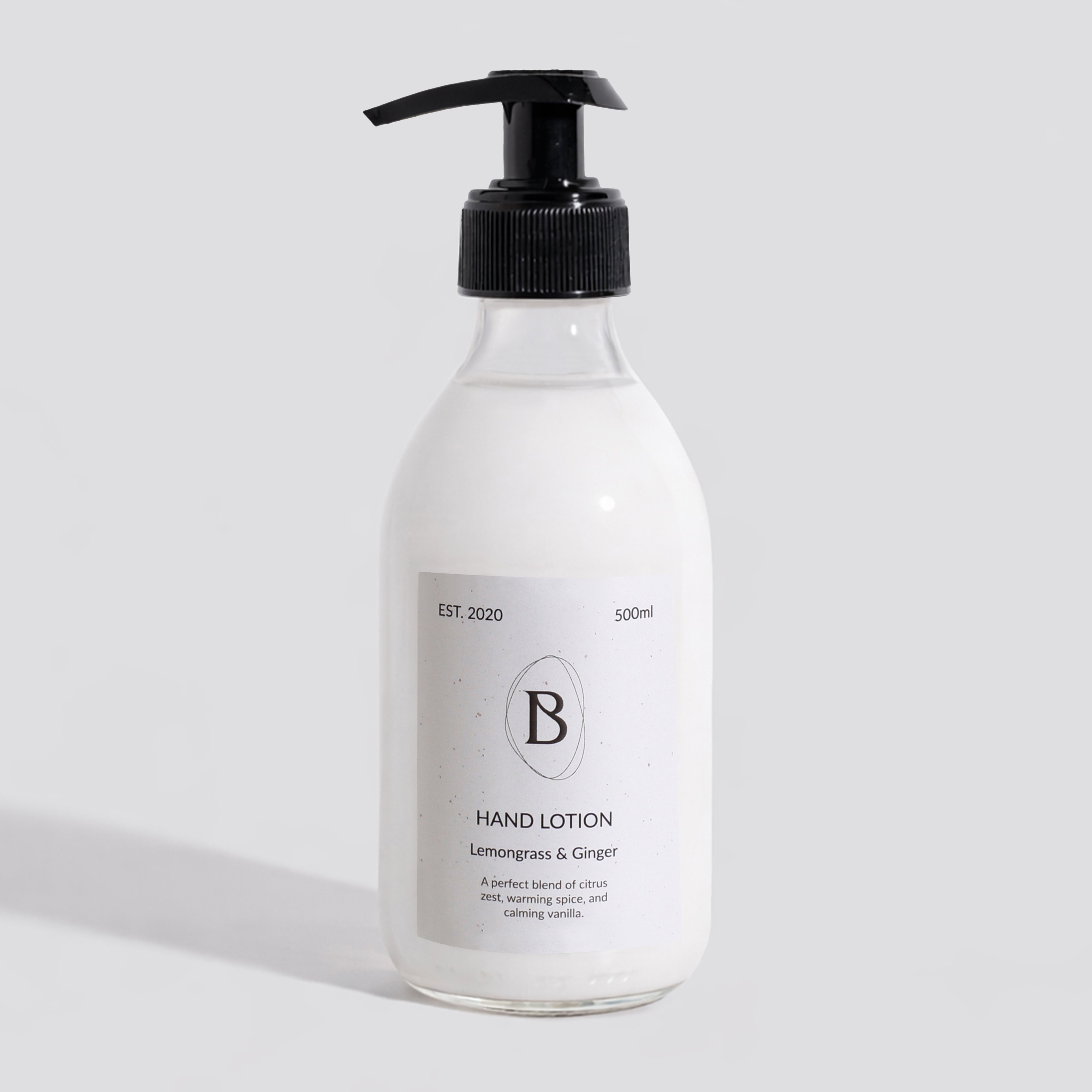 Hand lotion bottle with pump on a light gray background
