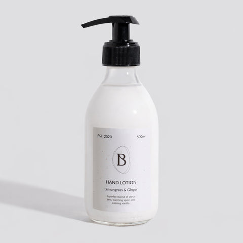 Hand lotion bottle with pump on a light gray background