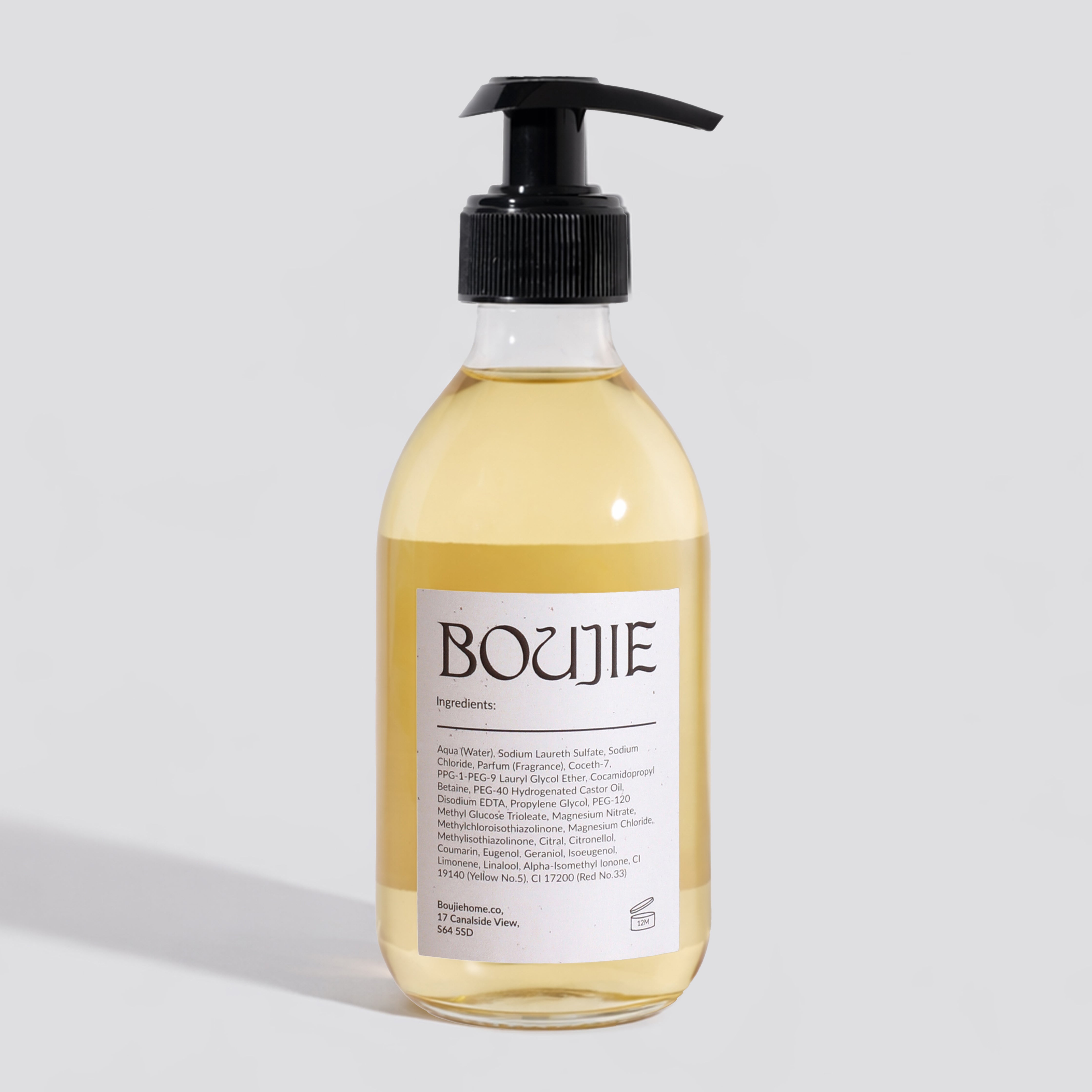 Bottle of Boujie product on a light gray background