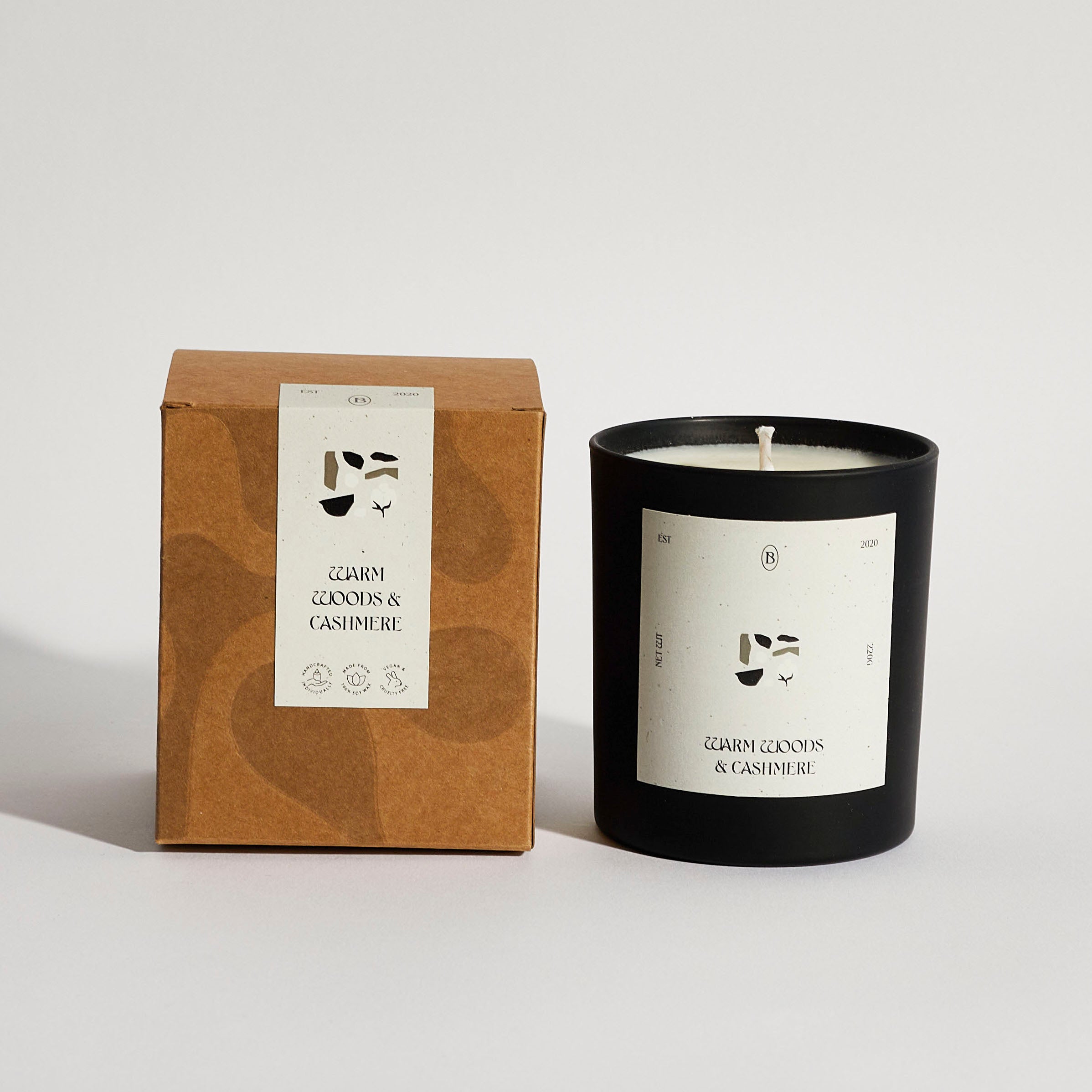 Boujie Warm Woods & Cashmere scented jar candle with packaging, handmade with natural soy wax – front view.