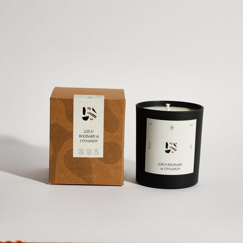 Boujie wild rhubarb and cinnamon black jar candle with packaging, handmade with natural soy wax – front view