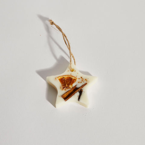 Single star soy wax tree decoration with dried orange and cinnamon.